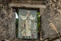 Religious scene on stained glass window in abandoned church on Yim Tin Tsai, an island in Sai Kung, Hong Kong Royalty Free Stock Photo