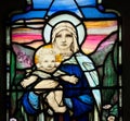 Religious Stained glass window. Baby Jesus, Virgin Mary