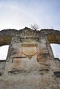 Religious symbol. Ruins of an ancient synagogue with arched windows, against the blue sky. Texture old dilapidated masonry Royalty Free Stock Photo
