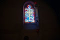 Religious theme cross in leadlight window