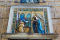 Religious wall relief in Florence, Italy