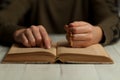 Religious woman reads gospel, humility and supplication