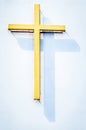 Religious yellow cross with shadow