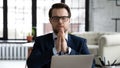 Religious Caucasian male employer praying in office Royalty Free Stock Photo