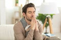 religious young man praying to god at home