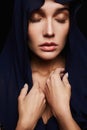 Religious young woman in hood