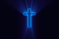 Religioush cross with blue color god rays shine on the dark background Royalty Free Stock Photo