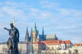 Religous statue on Charles Bridge with St Vitus Cathedral Royalty Free Stock Photo