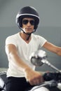 Relishing his ride. A handsome young man sitting on his motorcycle. Royalty Free Stock Photo