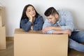 Relocation Stress. Young Couple Feeling Tired While Moving Home