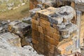remains of the ancient antique buildings of Hierapolis from limestone blocks, dilapidated walls