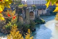 The remains of the ancient Ponte Rotto Broken Bridge with Isola Tiberina in the background, Roma