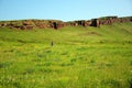 Remains of an ancient wall on top of a high hill overlooking the valley