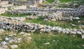 Remains of ancient walls on the site of a destroyed antique city Royalty Free Stock Photo