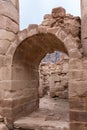 The remains of the arched passage between the halls in remains of Roman Temple in Petra. Near Wadi Musa city in Jordan Royalty Free Stock Photo