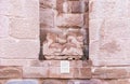 The remains of a bas-relief in a niche in the ruins of Roman Temple in Petra. Near Wadi Musa city in Jordan Royalty Free Stock Photo