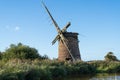 The remains of Brograve mill in North Norfolk, UK in landscape orientation on a blue sky day