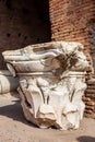 Remains of the capitals of the ancient columns at the Colosseum in Rome