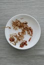 Remains of chicken yakisoba noodles in a white plate