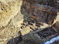 Remains of dead people in the ground, bones of killed people. Victims of persecution and torture. Crimes against humanity theme