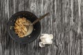 Remains of flakes in a plate. Remainder of food from a breakfast.