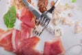 The remains of food on a plate with a knife and fork on a white stones background. Copy space. Royalty Free Stock Photo