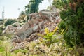 Remains of hurricane or earthquake disaster damage on ruined old house with collapsed roof and walls on the pile Royalty Free Stock Photo