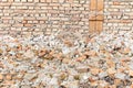 Remains of hurricane or earthquake disaster total damage on ruined old house or building with pile of bricks Royalty Free Stock Photo