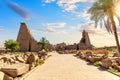 Remains of Karnak Temple behind the palm tree, Luxor, Egypt Royalty Free Stock Photo