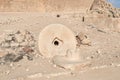 Remains of a millstone near the ruins of city - fortress of Nabateans Avdat, on trade route called Way of Incense, near Mitzpe
