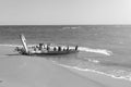 remains of old boat on shore. wooden longtail covered by sand. Travel landscape tropical sea beach