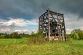 Remains of old burnt windmill in the field before the rain Royalty Free Stock Photo