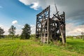 Remains of old burnt windmill in the field before the rain Royalty Free Stock Photo