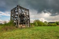 Remains of old burnt windmill in the field before the rain Royalty Free Stock Photo