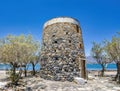 Remains of an old, stone windmill on the Kolokitha peninsula near the town of Elounda, Crete Royalty Free Stock Photo