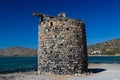 Remains of old traditional Greek windmills near Elounda, Crete Royalty Free Stock Photo