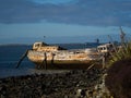 Remains ruins of an old historical capsized tilted fishing boat ship wreck at Greenpoint Ship Graveyard New Zealand