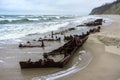 The remains of a seagoing vessel on the shore. Old Rusty Ship. The rusted wreckage of an old ship