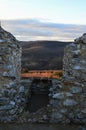 Remains of small square room in castellated wall of medieval castle Hrusov, possibly embrasure.