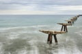 Remains of the structure of an old dock in the Port of Sagunto Royalty Free Stock Photo