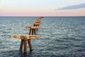 Remains of the structure of an old dock in the Port of Sagunto Royalty Free Stock Photo