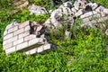 The remains of the white brick structure are overgrown with grass Royalty Free Stock Photo