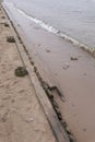 Remains of wooden fortifications on the beach of the Peter and Paul Fortress Royalty Free Stock Photo