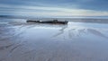 The remains of the wreck of the Hanseat, on Warkworth Beach on the coast of Northumberland.