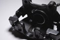 Remanufactured disc brake caliper painted dark gray. Brake system restoration Royalty Free Stock Photo