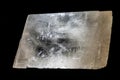A remarkably clear and translucent mineral specimen, displaying a blocky, somewhat rectangular or rhombohedral cleavag Royalty Free Stock Photo