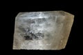 A remarkably clear and translucent mineral specimen, displaying a blocky, somewhat rectangular or rhombohedral cleavag Royalty Free Stock Photo