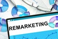 Remarketing on tablet with graphs. Royalty Free Stock Photo