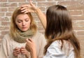 Remedies should help beat cold fast. Tips how to get rid of cold. Woman feels badly ill sneezing. Girl in scarf hold Royalty Free Stock Photo