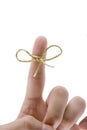 Remember concept, finger with gold tie Royalty Free Stock Photo